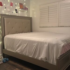 Goldish bed frame with installed LEDS